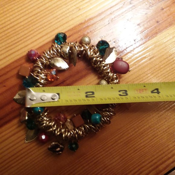 Gold stretch bracelet with charms - Picture 4 of 5